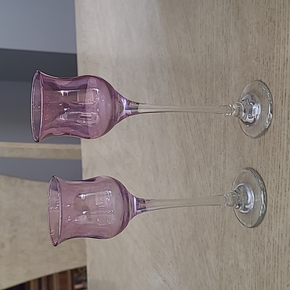 Pair of glass plum-colored candle holders, irredescent, different sizes